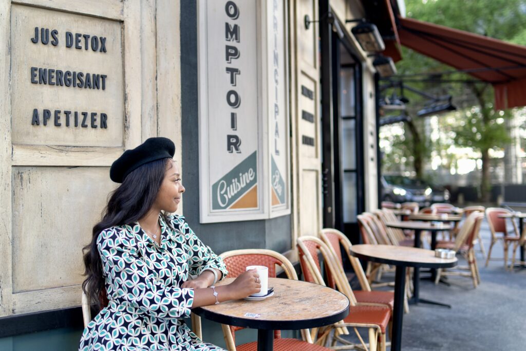 Lady driving coffee at cafe